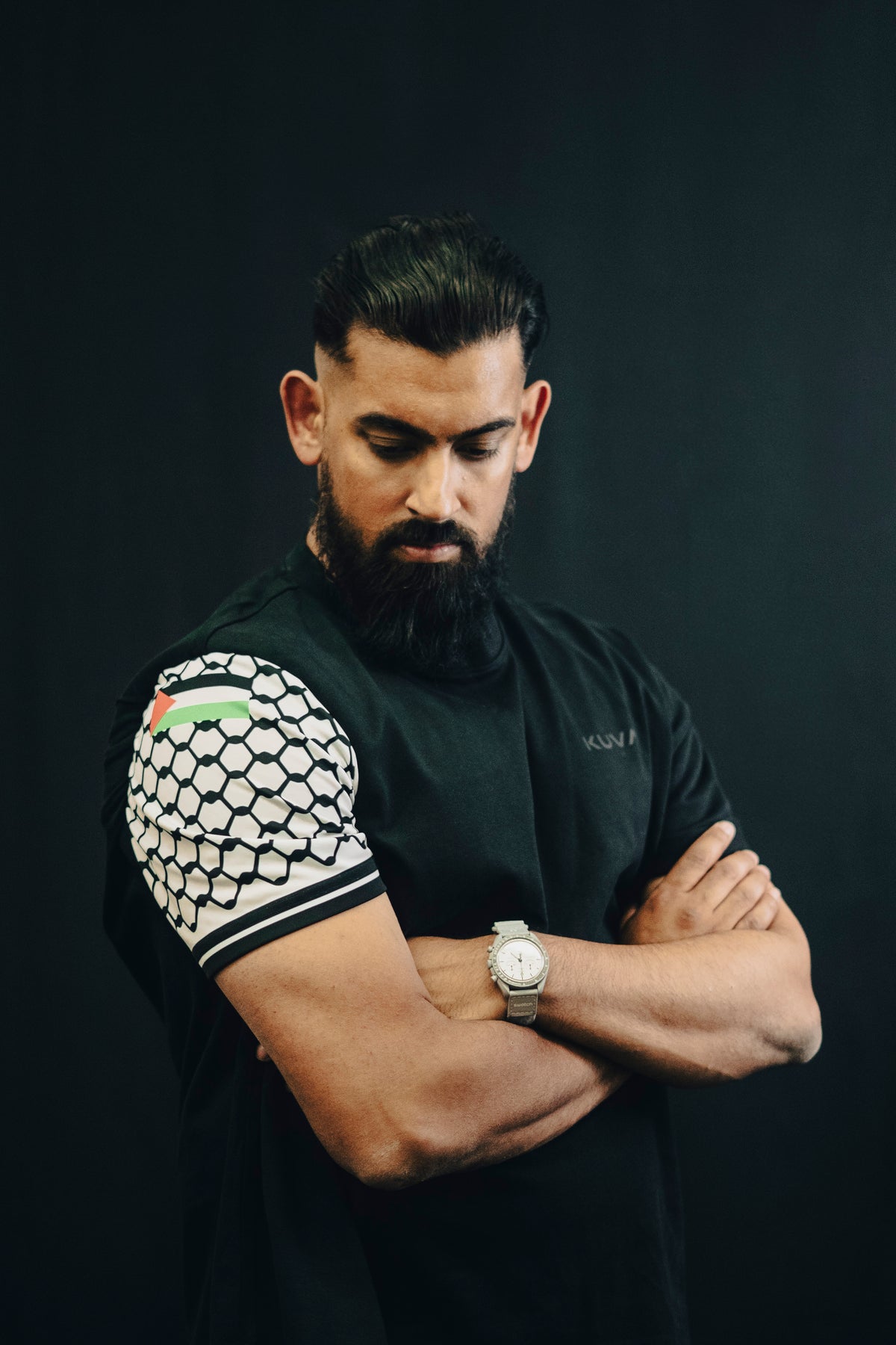 KUVA apparel with a Palestinian flag and keffiyeh pattern on the sleeve