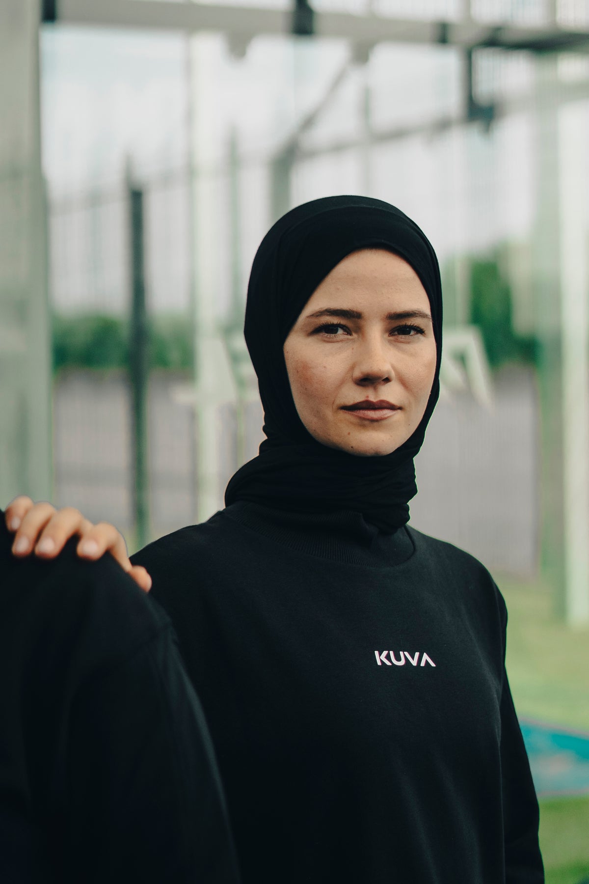 Sophia in KUVA apparel, shown in monochrome