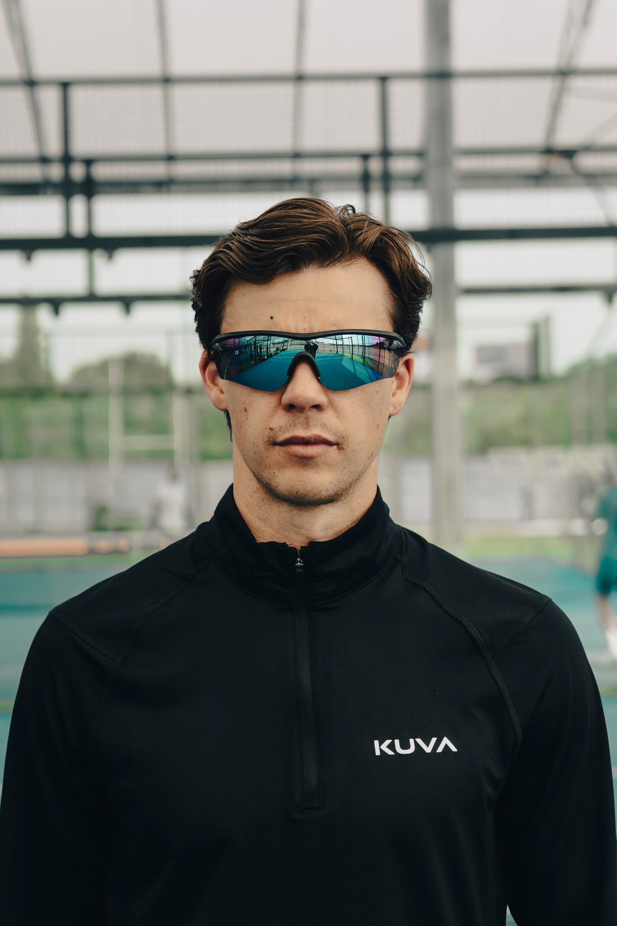 Alex in black KUVA apparel on court
